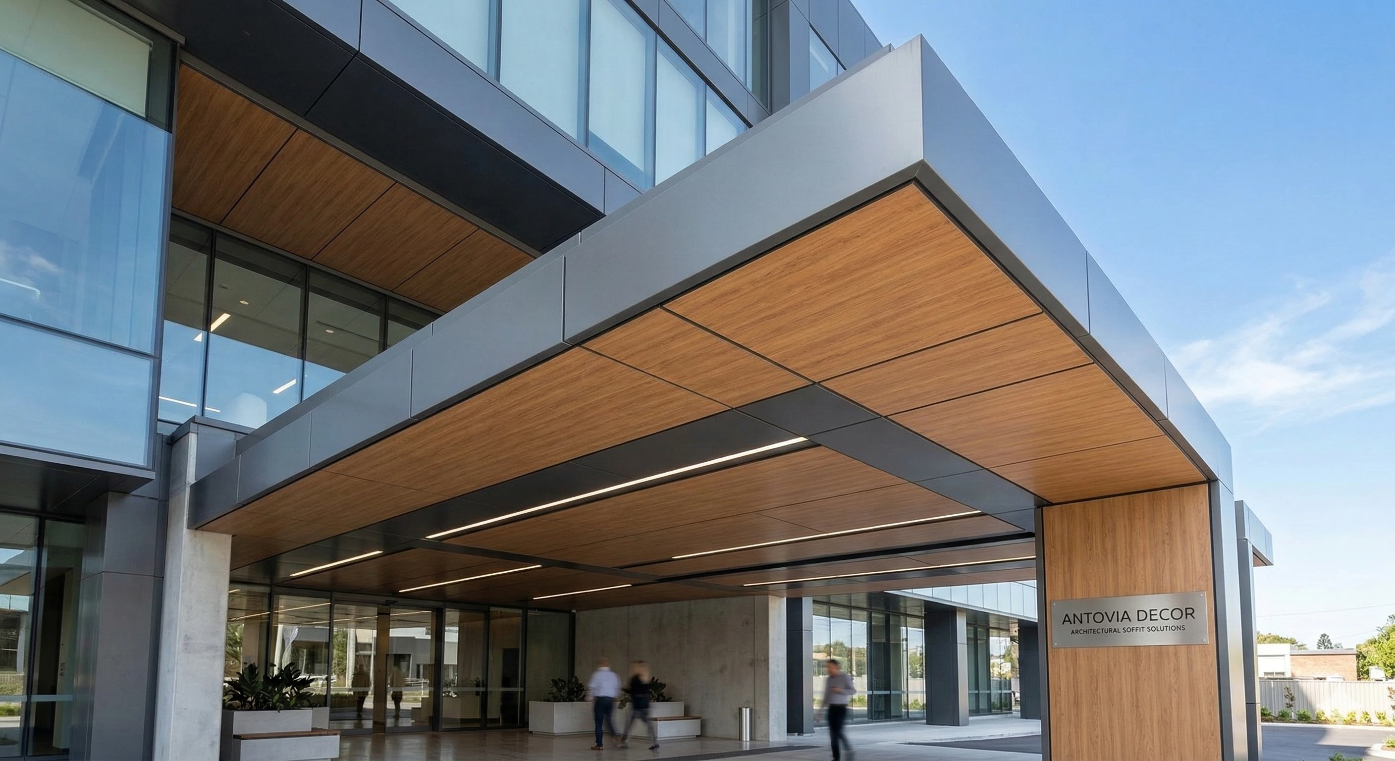 Modern exterior soffit panels installed on a commercial building canopy, featuring weather-resistant HPL and aluminium finishes by Antovia Decor for durable facade protection.